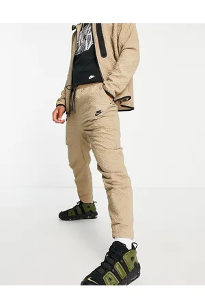 Nike Textured tech fleece woven trousers in khaki beige