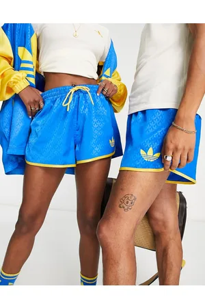 adidas Adicolor 70s' unisex monogram shorts in