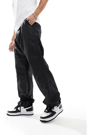 ASOS DESIGN baggy nylon track pants with contrast piping in stone