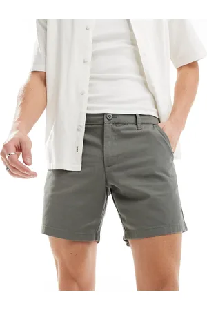 ASOS DESIGN pleated shorts in mid length in tan