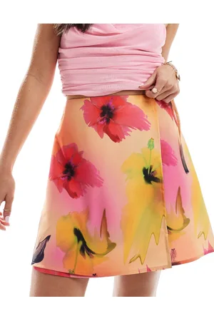 Monki Mini wrap skirt with tie up side in hibiscus print