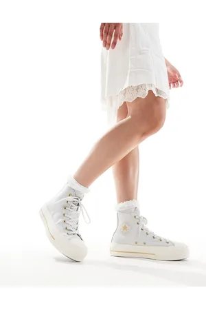 Converse Chuck Taylor All Star Lift Hi trainers in with gold details