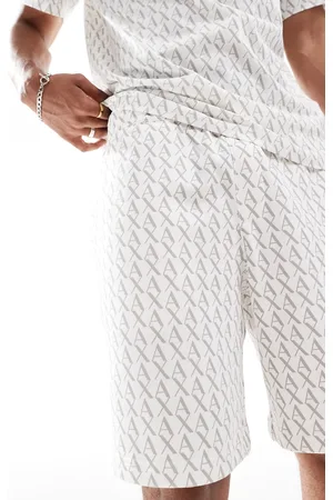 Armani Exchange Co-ord jersey shorts with all over logo print in