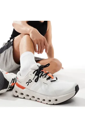 On Running ON Cloudrunner 2 running trainers in and beige