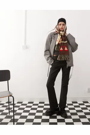 COLLUSION Low rise pinstripe kick flare trousers in black