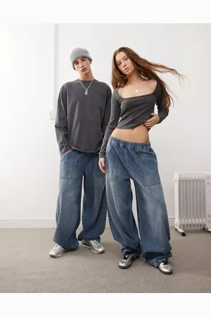 Reclaimed Unisex elasticated waist balloon jeans in mid