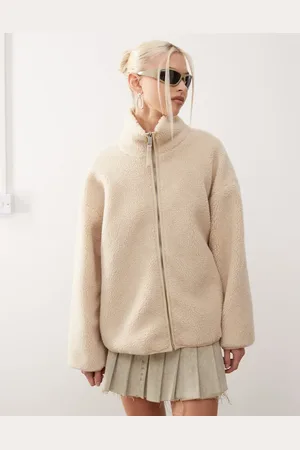 Monki Long sleeve zip through fleece with contrasting trims in off white with pink floral lining