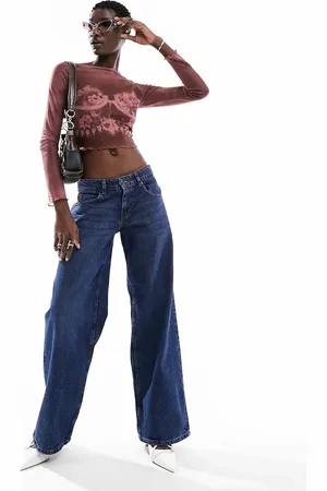 Motel Extra wide low rise jeans in mid used wash
