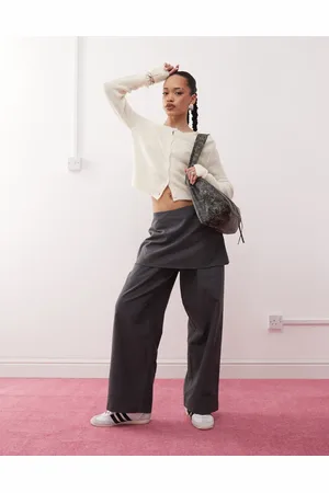 Reclaimed Mini skirt over trousers in