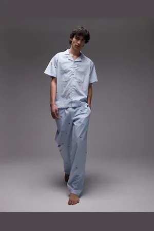 Lacoste Loungewear trousers in light with all over croc print