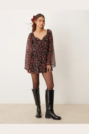 Miss Selfridge Long sleeve playsuit in black ditsy floral print