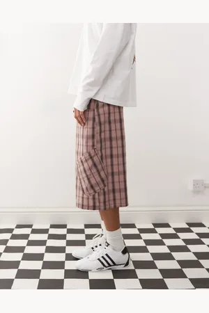 COLLUSION Baggy longline jorts in check