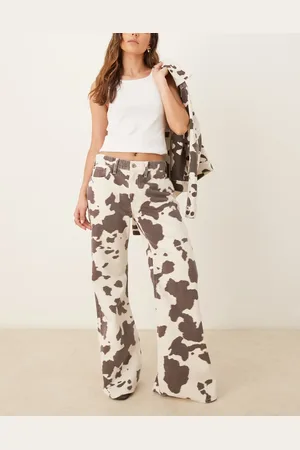 Abercrombie & Fitch Mid rise baggy bootcut jean in cow print