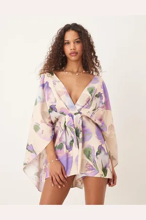 ASOS Exaggerated sleeve plunge playsuit in abstract floral print