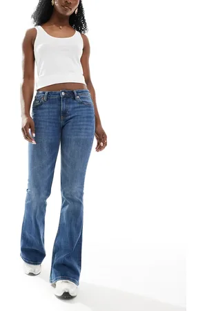 Monki Katsumi low rise flared leg jeans in fade wash