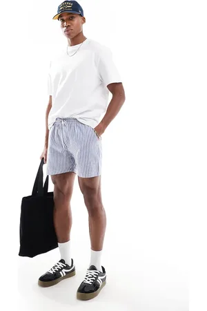 Another Influence Striped relaxed fit shorts in blue and white