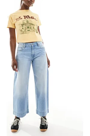 Bershka Ankle length wide leg jeans in mid wash