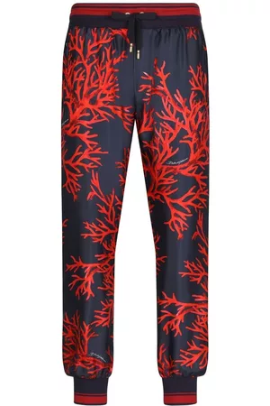 Dolce & Gabbana Homem Calças - Coral-print silk trousers