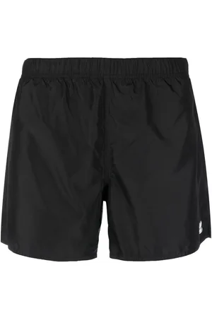 Courrèges Logo-patch plain swim shorts