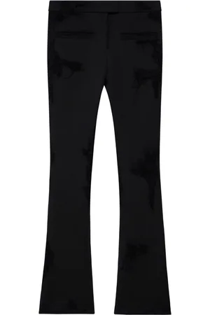 Courrèges Distressed-effect flared trousers