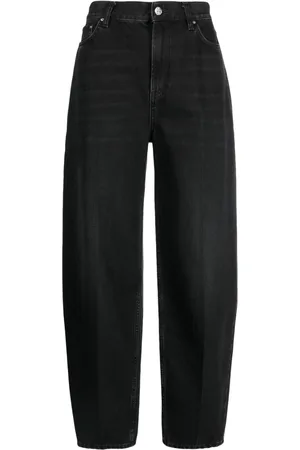 Totême Faded-effect tapered-leg jeans