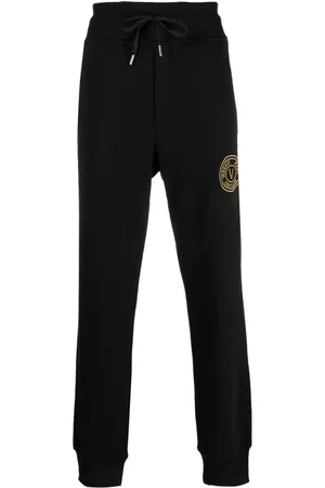 Versace logo-embroidered slim-fit Jeans - Farfetch