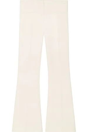 Courrèges Low-rise flared crepe trousers