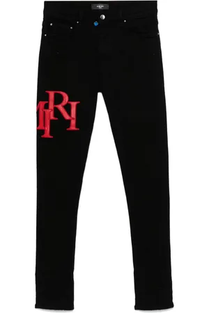 AMIRI Staggered-logo-embroidered jeans