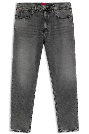 HUGO BOSS Calças de ganga tapered fit em ganga cinzenta com efeito usado