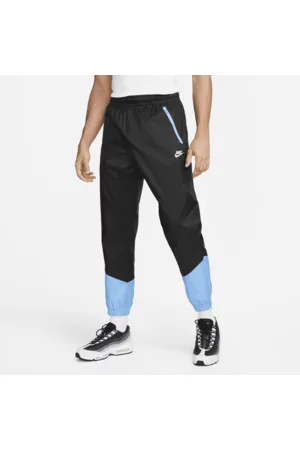 Nike Homem Calças - Calças entrançadas com forro Windrunner para homem