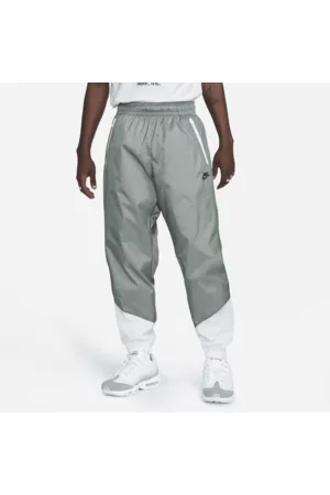 Nike Homem Calças - Calças entrançadas com forro Windrunner para homem