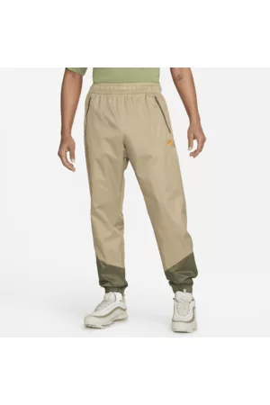Nike Homem Calças - Calças entrançadas com forro Windrunner para homem