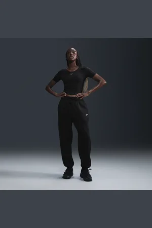 Nike Calças de fato de treino folgadas de cintura subida Sportswear Phoenix Fleece para mulher
