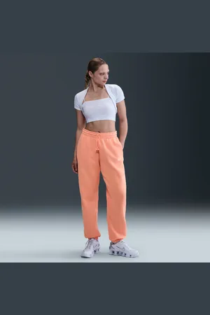 Nike Calças de fato de treino folgadas de cintura subida Sportswear Phoenix Fleece para mulher