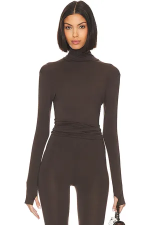 Norma Kamali Slim Fit Long Sleeve Turtle Top in - . Size L (also in M, S, XL, XS, XXS).