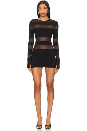Norma Kamali Spliced Long Sleeve Pickleball Dress in - Black. Size L (also in M, S, XL, XS, XXS).