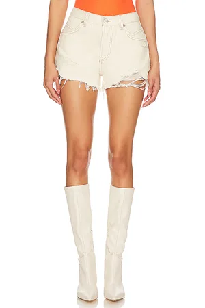 Free People X We The Free Now Or Never Denim Short in - Cream. Size 24 (also in 26, 27, 28, 29).