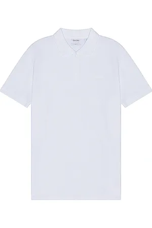Calvin Klein Move Zip Polo in - White. Size L (also in S, XL/1X).