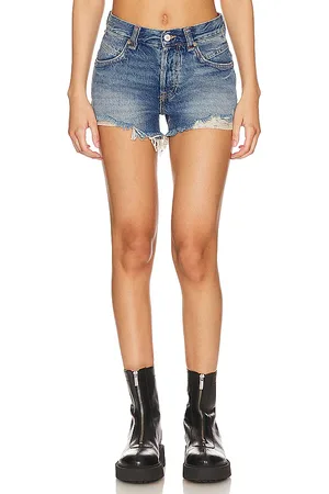 Free People X We The Free Now Or Never Denim Short in - Denim-Medium. Size 25 (also in 26).