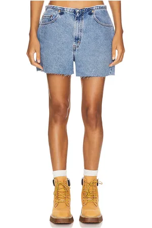 aligrace Undone Mini Rise Short in - Denim-Medium. Size 24 (also in 33, 34).