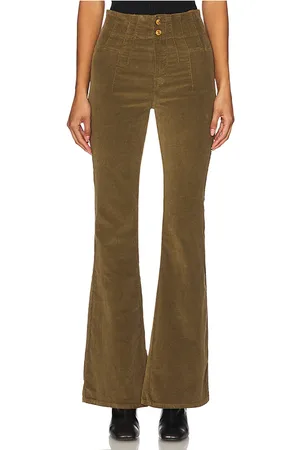 Free People X We The Free Jayde Cord Flare in - Olive. Size 25 (also in 27, 28, 29, 31).