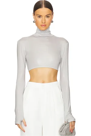 Norma Kamali Cropped Slim Fit Long Sleeve Turtleneck Top in - Light Grey. Size L (also in S, XL, XS, XXS).