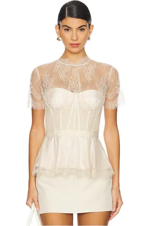 Simkhai Kehlani Lace Short Sleeve Bustier Top in - Ivory. Size 0 (also in 2, 4, 6).