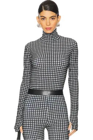 Norma Kamali Slim Fit Long Sleeve Turtleneck Top in - Black,White. Size XS (also in XXS).