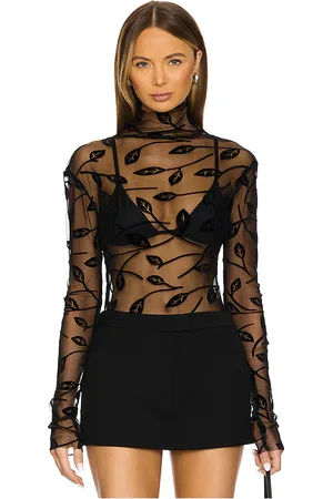 Norma Kamali Long Sleeve Turtleneck Top in - Black. Size L (also in M, S, XL, XS).