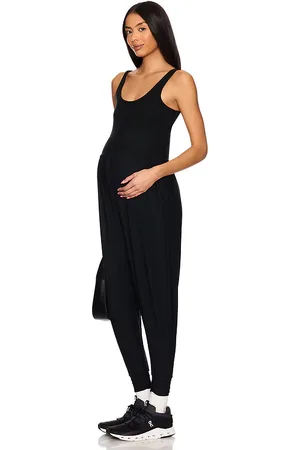 Beyond Yoga Spacedye Grow in Comfort Maternity Jumpsuit in - Black. Size L (also in M, S, XS).