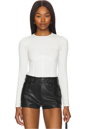 FLEUR DU MAL Organic Cotton Long Sleeve T-shirt Bodysuit in - . Size L (also in M, S, XL, XS).