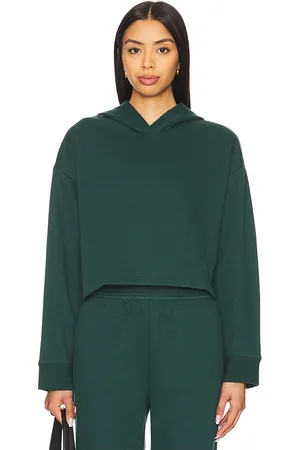Beyond Yoga Luxe Fleece Happiness Cropped Hoodie in - Dark Green. Size L (also in M, S, XL, XS).