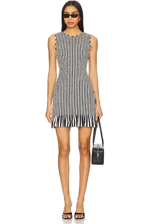 SIMON MILLER Belle Smocked Mini Dress in - Black. Size L (also in M, S, XL).