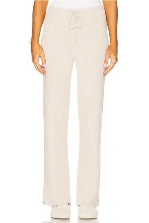 Barefoot Dreams CozyChic Ulra Light Slim Ribbed Pant in - Beige. Size M (also in L, S, XL, XS).